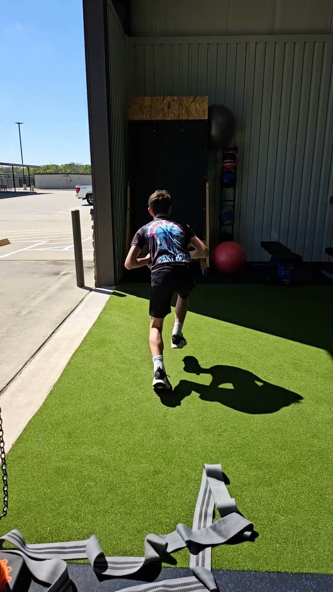 Athlete accelerating out of the Activ8 facility bay door